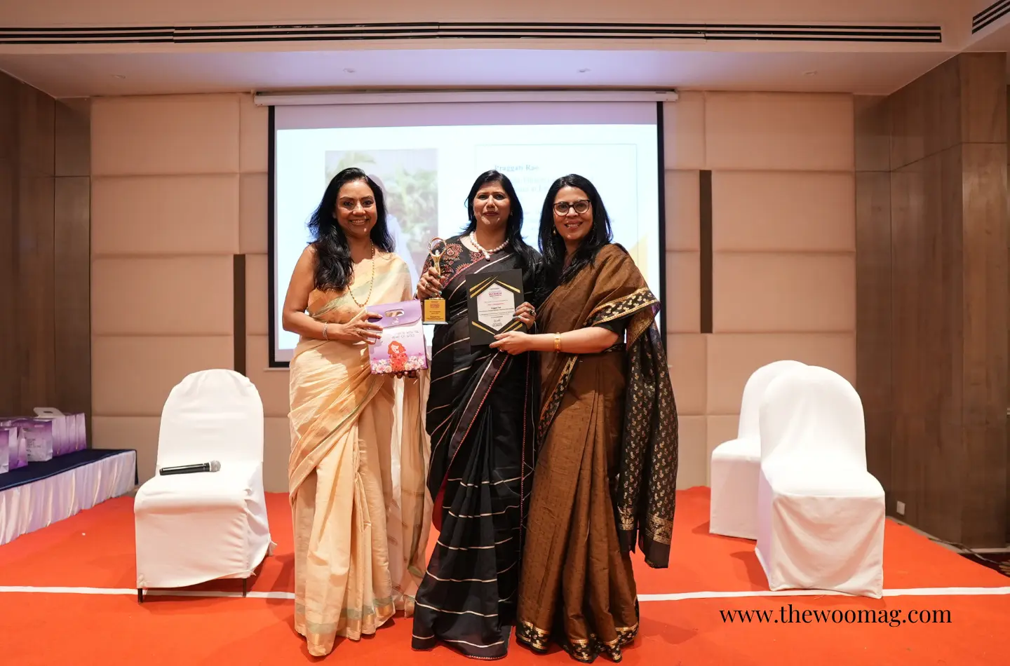 cover-PraggattiRao-receiving-award-himanshi-lydia-singh-at-unstoppable-summit-with-Nina-Benjamin.webp